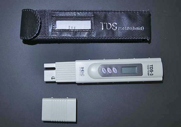 Photograph of HM TDS-3 handheld aquarium "total dissolved solids" meter and thermometer.